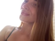 Pretty girl licking her fingers. 6/16