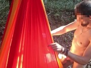 My girlfriend is lying in a hammock and I'm fucking her in the mouth