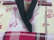 Girl in gray long socks on her legs caresses herself in bed 3/16