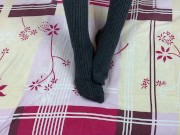 Girl in gray long socks on her legs caresses herself in bed 4/16