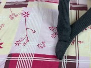 Girl in gray long socks on her legs caresses herself in bed 7/16
