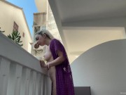 Naked in public on a balcony overlooking neighboring houses. 9/16