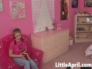 Little April sit in Bubble Chair and strip off showing her natural tits and Pussy. She fingering har 1/16
