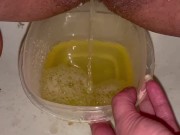 Babe does close up piss in Tupperware container 10/16