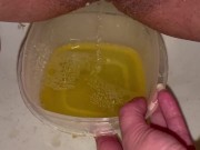 Babe does close up piss in Tupperware container 12/16