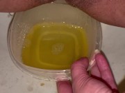 Babe does close up piss in Tupperware container 13/16