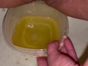 Babe does close up piss in Tupperware container 16/16