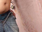 The guy jerks off his dick behind the garage and cums 15/16