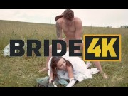 BRIDE4K. Pretty brunette bride fucks a horny shepherd in a summer field 1/16