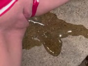 Girl pulls panties to the side to piss on steps