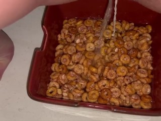 Girl pees in a bowl of cereal