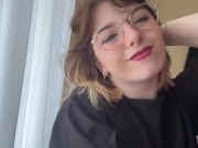 Attractive brunette in a t-shirt shows off her beautiful tits