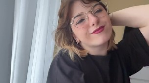 Attractive brunette in a t-shirt shows off her beautiful tits