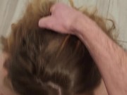 Curvy redhead gets on her knees and swallows for the first time