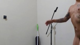 More of the naked of a ballerina practicing of the center portion of the ballet.