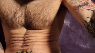 Horny tattooed hunk unloading his hairy ballsack like a bull.