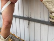 Milf in boots pees at the fence 7/16