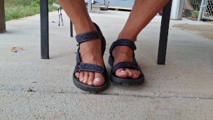 My male pedicured feet in sandals