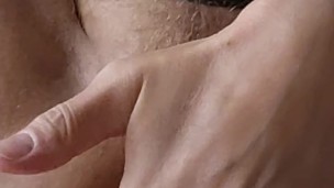 Gay man fucks himself with a big dildo whilst wearing a jockstrap. He jerks off and cums.