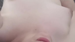 A trans woman masturbates and is surprised by her partner who decides to make her come