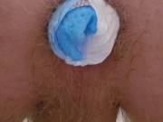 Pushing 2 rolled diapers out