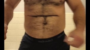 HAIRY MUSCLE BEAR STRIPPING TO BOXER BRIEFS AND FLEXING