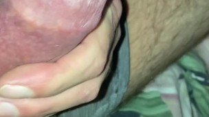 Squeezing and smearing a drop of precum, edging my cockhead gently