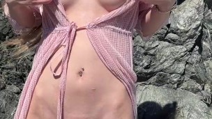 Petite princess teases on a public beach before sex
