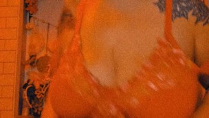 Big tit beauty in red strip tease