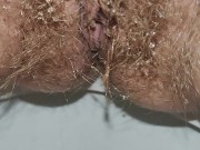 Hairy milf takes out a pink menstrual cup and pees on last day of period