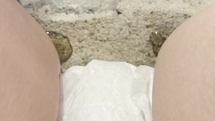 babe lifts up dress on steps to show her diaper while pissing and smoking