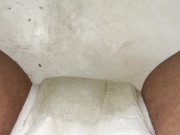 Girl having a smoke while peeing in her diaper