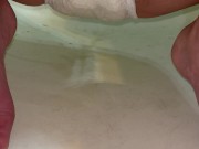 Babe pisses her diaper and then rings it out for the cam