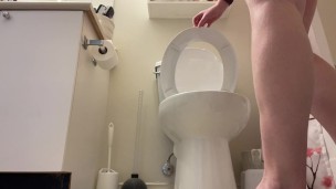 Girl peeing into toilet while standing up, trying to pee like a guy naked ass view girl standing pee
