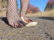 Goth girl crushing fruit in fishnet clad feet - Screenshot 2 of 16 - HD