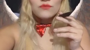 Angel of hell. Halloween costume. Cute girls smoke with me