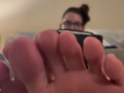 Ignoring you, wiggling my sweaty toes in your face while I cool down after my workout.