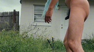 twink trimming the grass naked outside