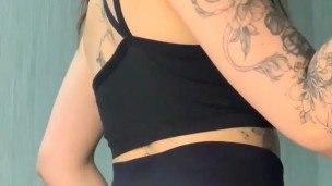 brunette shows her ass in tight shorts