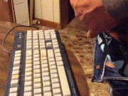 Masturbating until I shoot my load on a computer keyboard