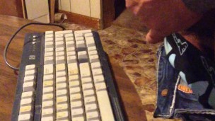 Masturbating until I shoot my load on a computer keyboard