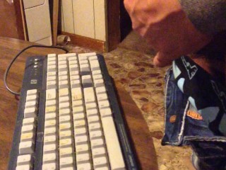 Masturbating until I shoot my load on a computer keyboard