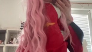 teen egirl cosplayer Zero Two playing with herself