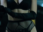 A model with an hourglass figure in long boots, stockings and black gloves seduces me in the parking 2/16