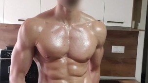 6'7" oiled muscular stud flexing and stroking his BWC