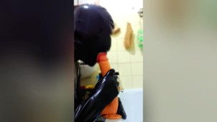 Latex Sissy In Chastity Throat Training