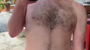 BUSHY UNCUT OTTER JERKS OFF IN MIRROR