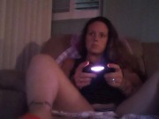Busty Wife In Red Mini Dress Playing Video Games and Smoking Cigarettes 10/16