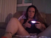 Busty Wife In Red Mini Dress Playing Video Games and Smoking Cigarettes 7/16