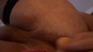 Chubby bottom fucking himself with dildo while wearing stockings